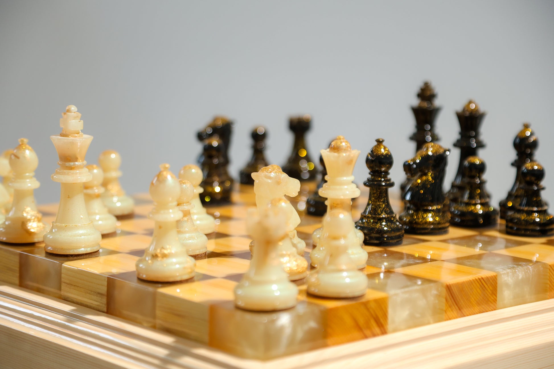 Granadas Amethyst Glow Chess Set – close-up of the purple and natural wood with epoxy resin pattern on the board